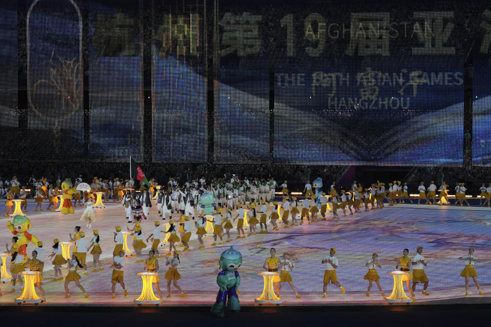 Athletes enter the stage during the opening ceremony of the 19th Asian Games in Hangzhou, China, Saturday, Sept. 23, 2023. (AP Photo/Aijaz Rahi)