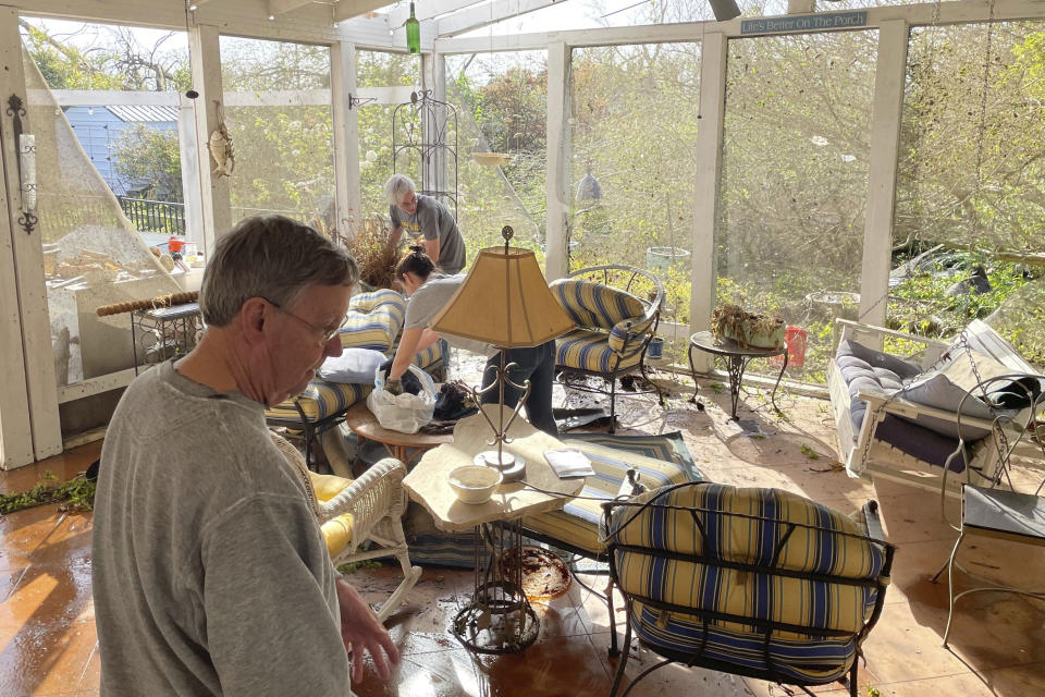 Noel Crook looks through damage at his home in Silver City, Miss., on Saturday, March 25, 2023. The roof had torn off Crook’s home, where he lives there with his wife. Emergency officials in Mississippi say several people have been killed by tornadoes that tore through the state on Friday night, destroying buildings and knocking out power as severe weather produced hail the size of golf balls moved through several southern states.(AP Photo/Michael Goldberg)