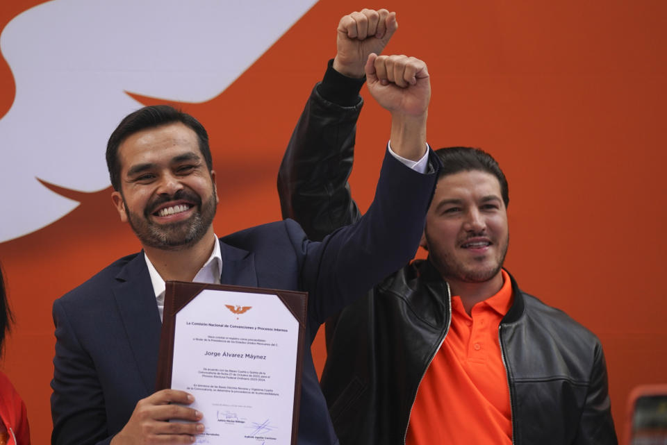 Accompanied by Nuevo León's Gov. Samuel Garcia, Rep. Jorge Álvarez Máynez holds his registration certificate after he was nominated by the Citizen’s Movement party to run for president in the upcoming general elections, in Mexico City, Wednesday, Jan. 10, 2024. The 38-year-old congressman will face front-runner Claudia Sheinbaum of the ruling Morena party, and opposition coalition candidate Xochitl Gálvez on June 2. (AP Photo/Fernando Llano)