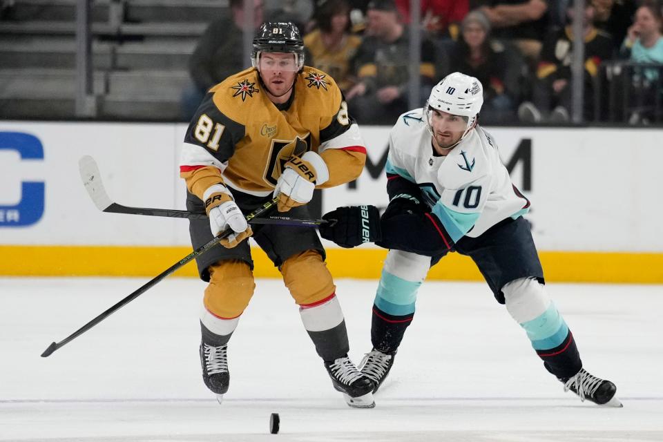 Vegas Golden Knights right wing Jonathan Marchessault (81) and Seattle Kraken center Matty Beniers (10) battle for the puck April 11. Beniers will make his playoff debut Tuesday when the franchise plays its first-ever NHL playoff game.