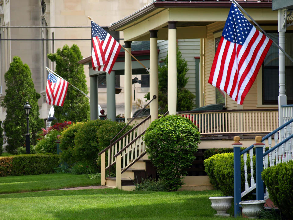 American flags flying on porches.