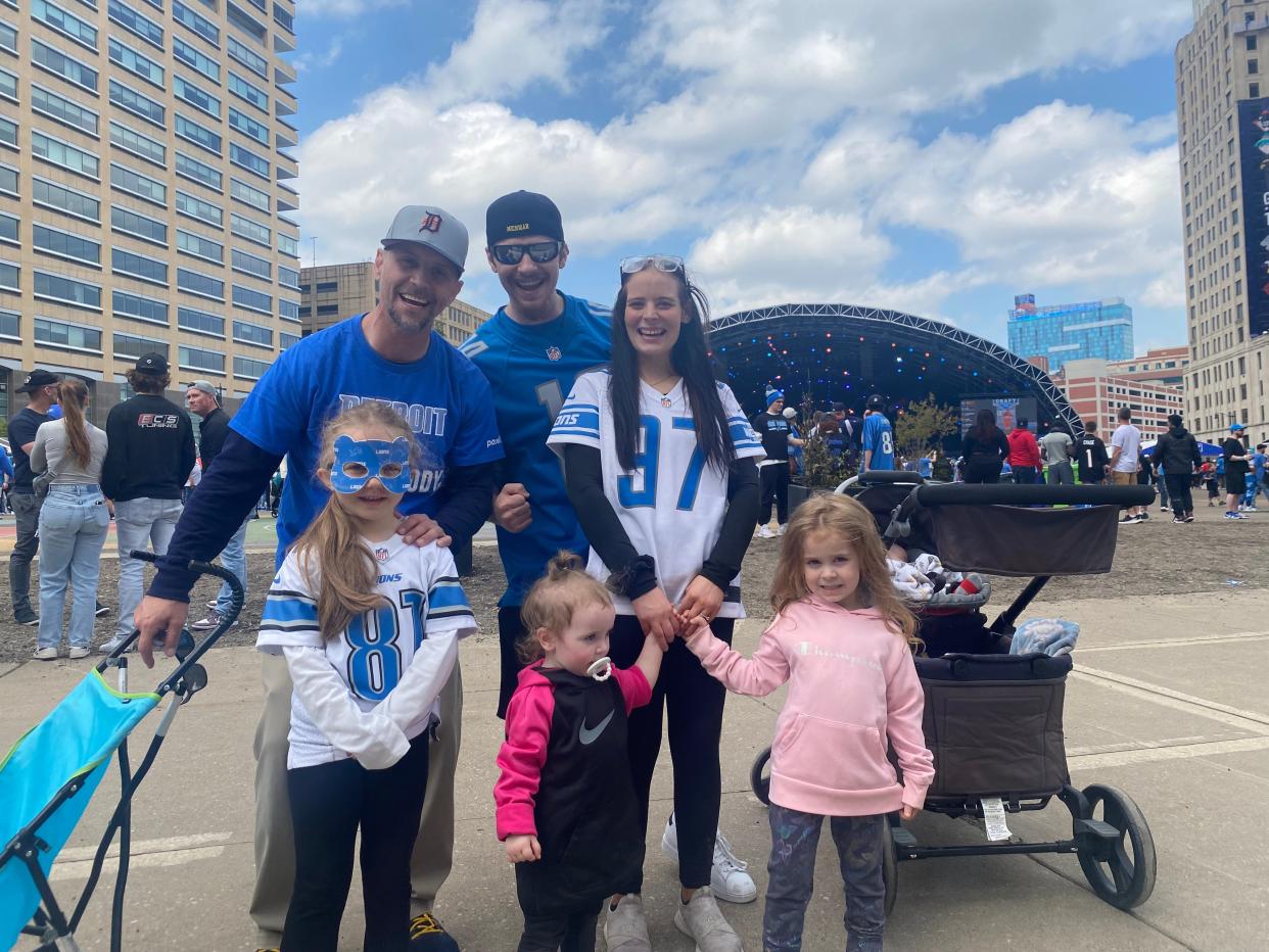 Lions fan Thomas Nunnally, 44, of Wixom, back left, smiles with his family Saturday, at the NFL draft in Detroit. Back row, left to right, Nunnally stands with Harrison residents Stephen Nunnally I, 23; Krista Allen, 24; and 5-month-old Stephen Nunnally II (in stroller). Shade’e Nunnally, 5, of Wixom; and Adalaya Nunnally, 2; and Peyton Nunnally, 4, both of Harrison, stand in front.