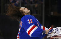 New York Rangers goalie Igor Shesterkin (31) flips his hair before an NHL hockey game against the San Jose Sharks, Friday, Dec. 3, 2021, in New York. (AP Photo/John Munson)