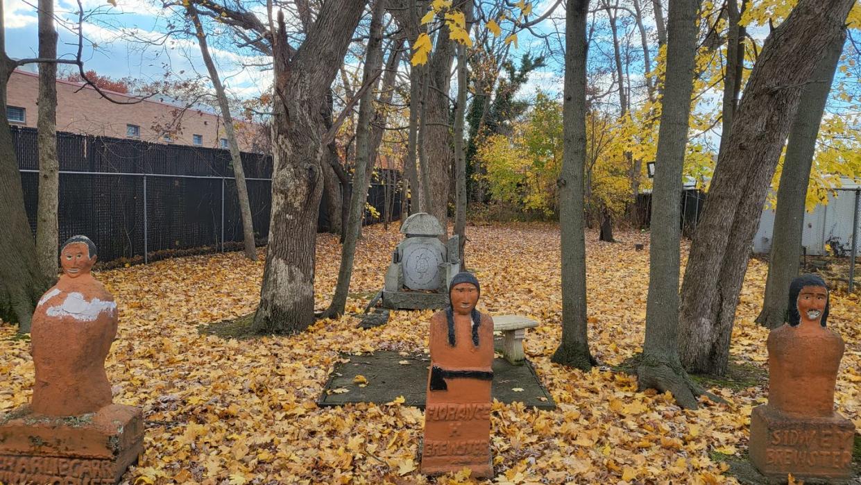 a group of statues in a park