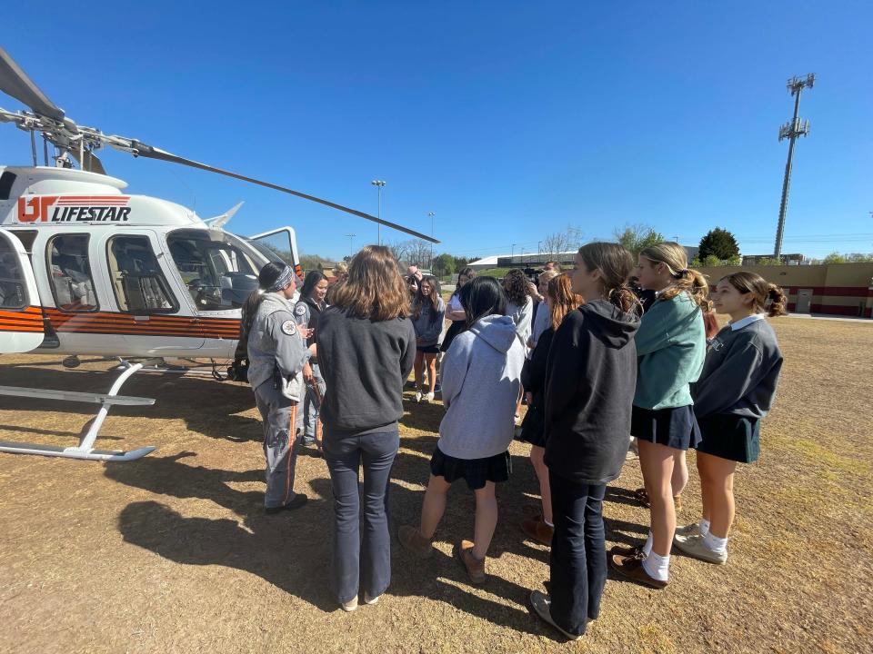 UT LIFESTAR helicopter flight nurses Brooke Bellman and Sierra Roccasalva give a talk to the Irish Medicine Club.