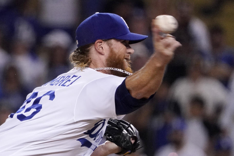 Los Angeles Dodgers relief pitcher Craig Kimbrel throws to the plate during the ninth inning of a baseball game against the Los Angeles Dodgers Sunday, Sept. 4, 2022, in Los Angeles. (AP Photo/Mark J. Terrill)
