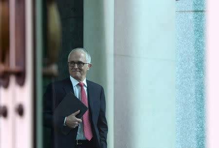 Australian Prime Minister Malcolm Turnbull arrives for a party room meeting at Parliament House in Canberra, Australia, August 21, 2018. AAP/Lukas Coch/via REUTERS