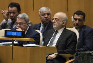 Iraq's Foreign Minister Ibrahim al-Jaafari listens as United Nations Secretary General Antonio Guterres addresses the 73rd session of the United Nations General Assembly, Tuesday, Sept. 25, 2018, at U.N. headquarters. (AP Photo/Mary Altaffer)