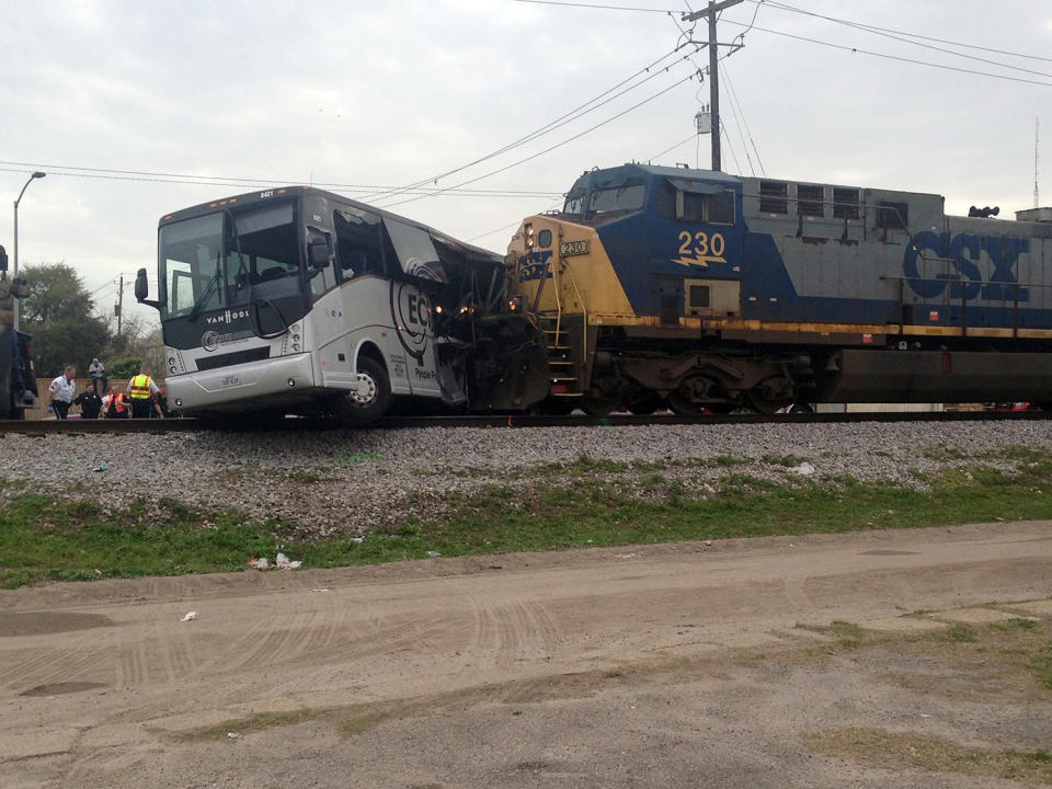 Train hits bus, killing 4