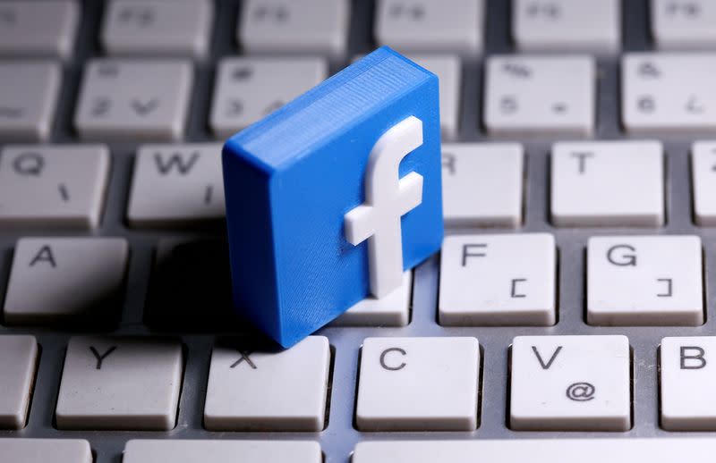 FILE PHOTO: A 3D-printed Facebook logo is seen placed on a keyboard in this illustration