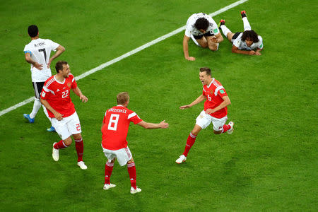 Soccer Football - World Cup - Group A - Russia vs Egypt - Saint Petersburg Stadium, Saint Petersburg, Russia - June 19, 2018 Russia's Denis Cheryshev celebrates scoring their second goal with team mates REUTERS/Michael Dalder