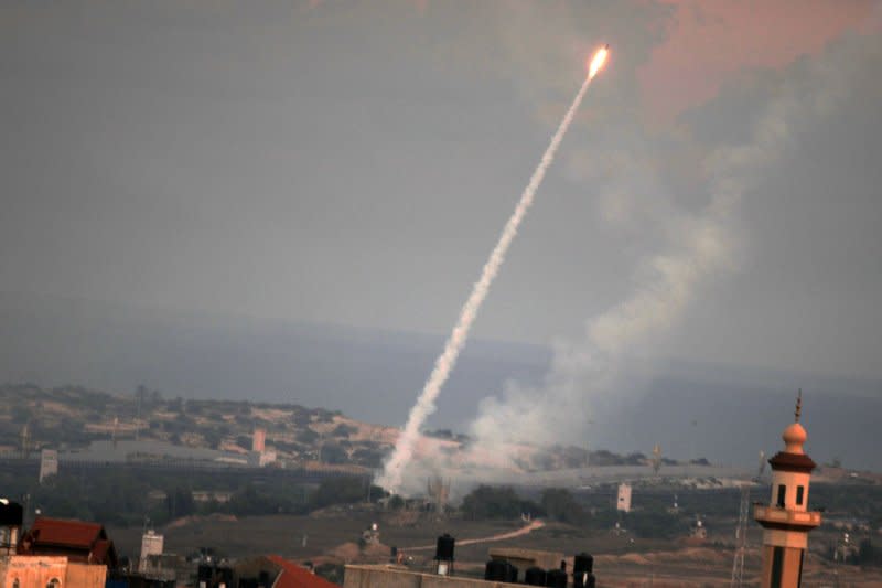 Rockets are shown being launched from the southern Gaza Strip towards Israel on Saturday. Israel declared it is 'at war' with Hamas militants after at least 40 were killed in a barrage that included thousands of rockets. Photo by Ismael Mohamad/UPI