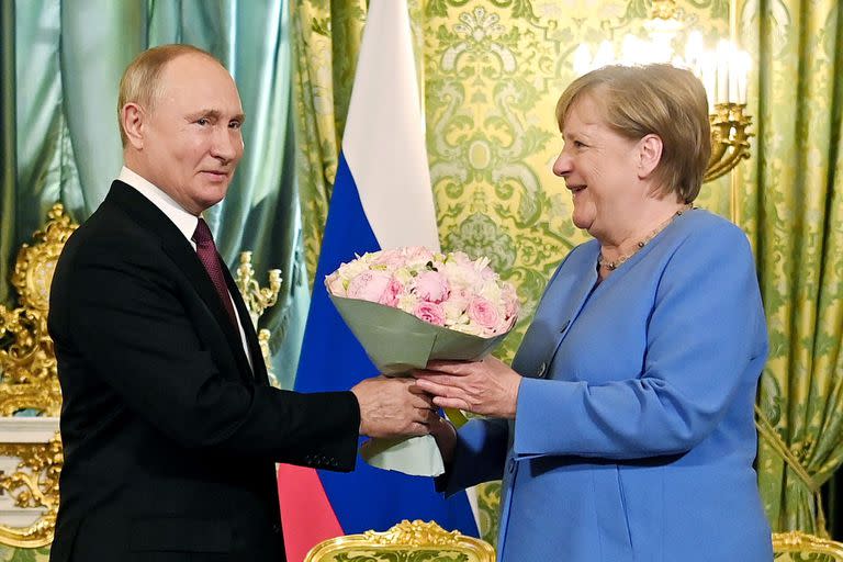 Vladimir Putin y Angela Merkel