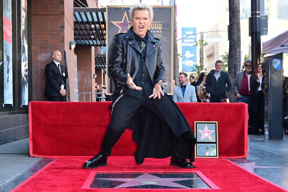 TOPSHOT - British-American singer Billy Idol poses for photos with his unveiled Star on the Hollywood Walk of Fame, in Hollywood, California, on January 6, 2023. (Photo by Frederic J. BROWN / AFP) (Photo by FREDERIC J. BROWN/AFP via Getty Images)