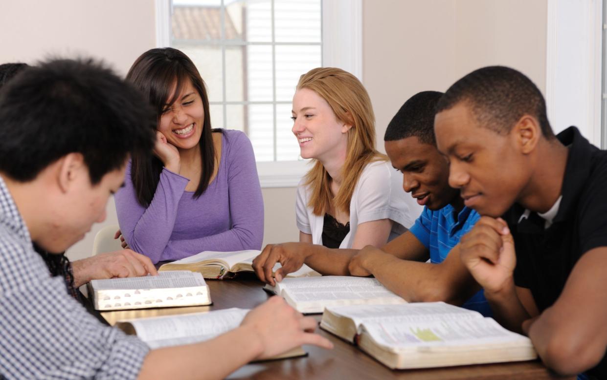 Pupils study the Bible