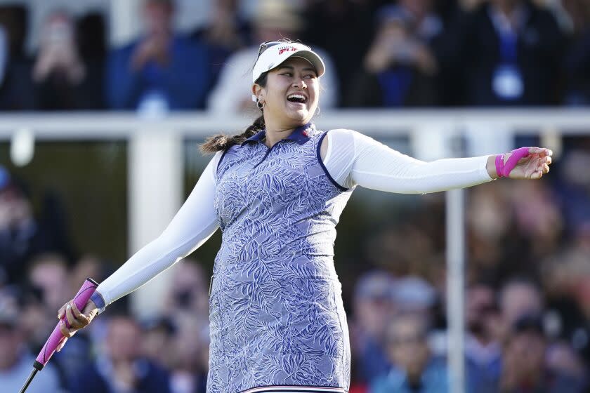 Lilia Vu of the US celebrates victory on the 18th green on day four of the 2023 AIG Women's Open at Walton Heath, in Surrey, England, Sunday Aug. 13, 2023. (John Walton/PA via AP)