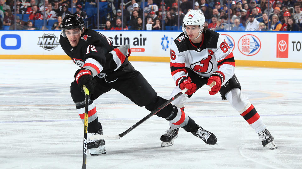 Tage Thompson (left) of the Buffalo Sabres and Jack Hughes (right) of the New Jersey Devils are two of the NHL's brightest young stars. (Photo by Bill Wippert/NHLI via Getty Images)