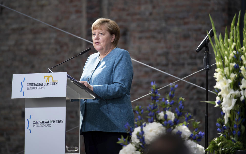 Chancellor Angela Merkel speaks at the ceremony to mark the 70th anniversary of the Central Council of Jews in the courtyard of the New Synagogue in Berlin, Germany, Tuesday, Sept. 15, 2020. The Central Council of Jews in Germany was founded on 19 July 1950 in Frankfurt am Main. (Bernd von Jutrczenka/Pool via AP)