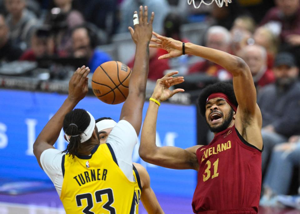 Apr 12, 2024; Cleveland, Ohio, USA; Cleveland Cavaliers center Jarrett Allen (31) loses the ball beside Indiana Pacers center Myles Turner (33) in the first quarter at Rocket Mortgage FieldHouse. Mandatory Credit: David Richard-USA TODAY Sports