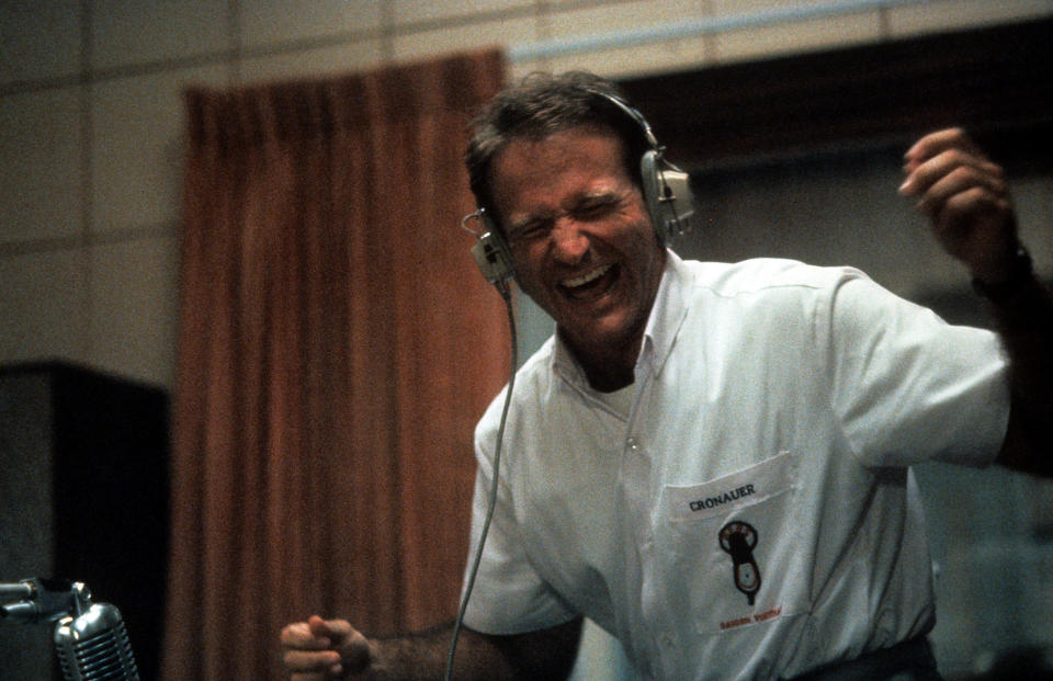 Robin Williams enjoying music through headset in a scene from the film 'Good Morning, Vietnam', 1987. (Photo by Buena Vista/Getty Images)