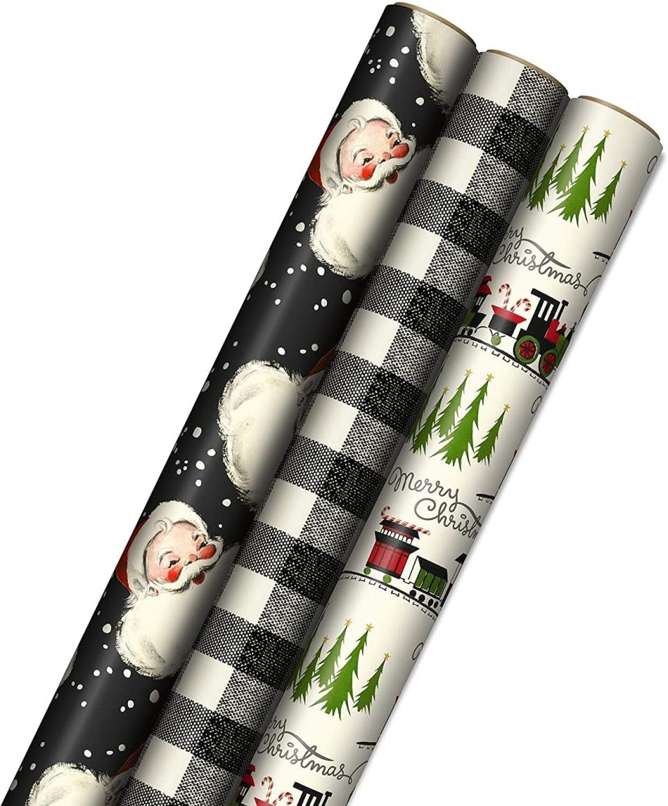 <p>If you want something festive, the <span>Hallmark Black Christmas Wrapping Paper </span> ($16 for three) has a unique, retro touch that adds a fun flair to the holidays. It has three rolls that feature a vintage santa print, awhite and black plaid patterm, and trains and trees scenery patterns. It even has cut lines on the back for easy wrapping. </p>
