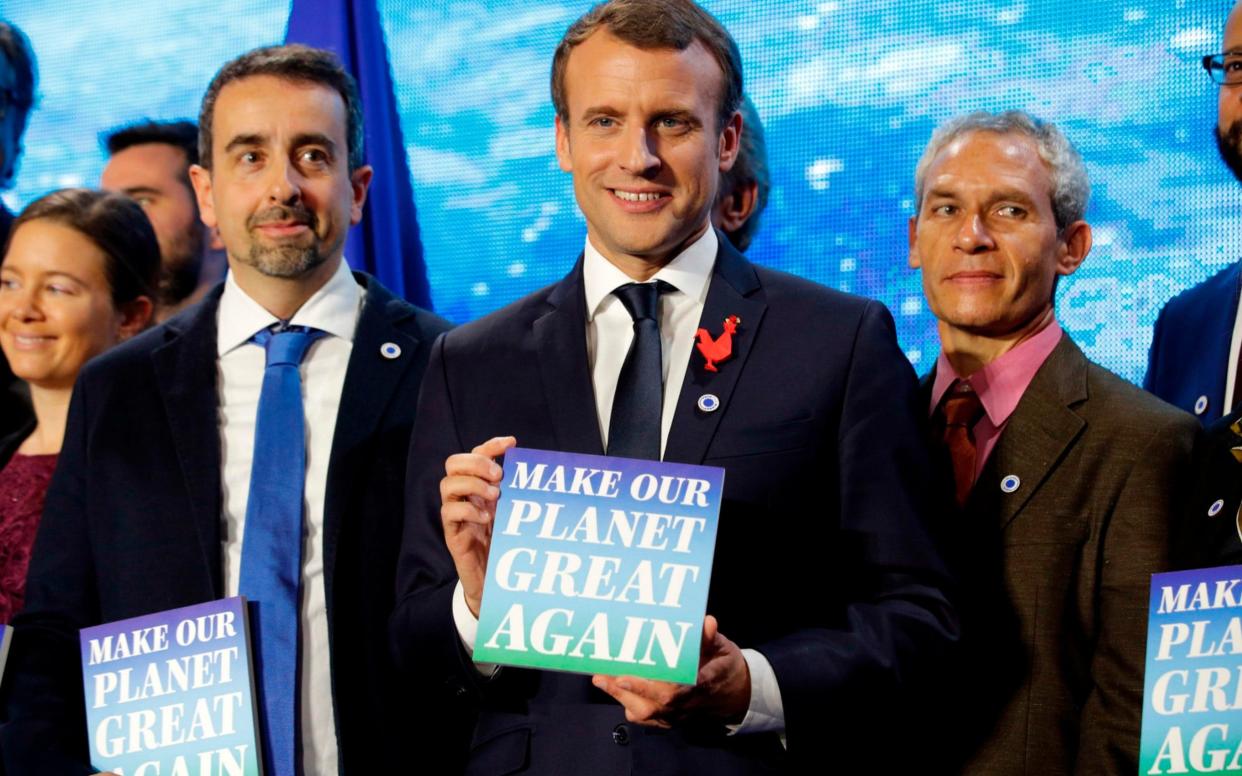 Macron says he wants to 'make our planet great again, a play on Trump's campaign slogan - AFP