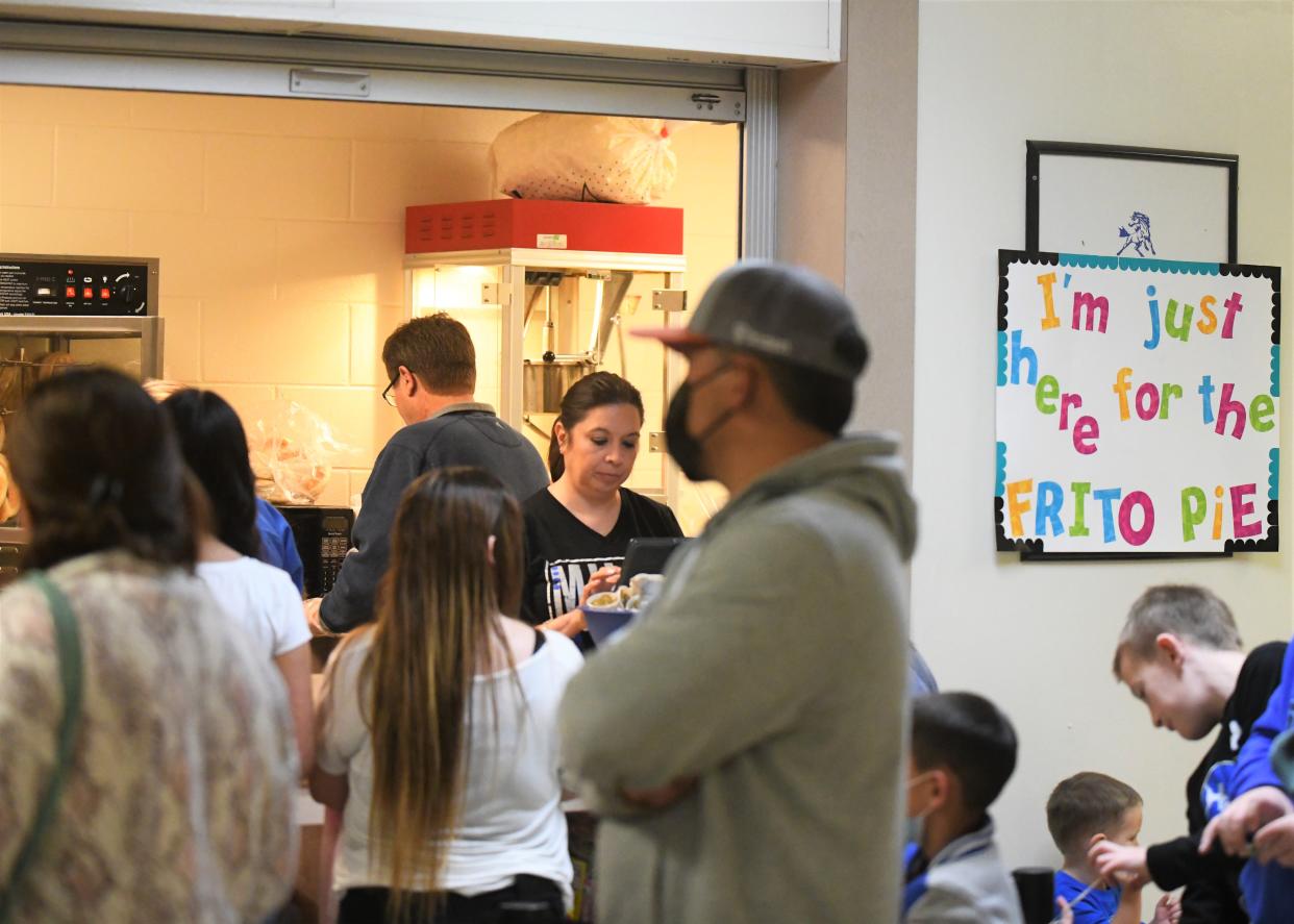 Fans stand in line at the concession stand before the Olton vs. Farwell boys basketball game Tuesday, Jan. 27, 2022, at Memorial Gymnasium in Olton.