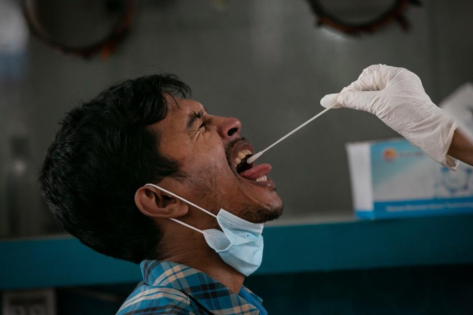 A man is tested for COVID during a countrywide lockdown on July 4, 2021, in Dhaka, Bangladesh.