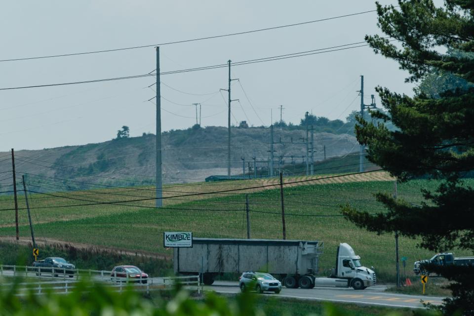 A Kimble trash hauler makes a turn onto landfill property from Ohio 39, Friday, June, 21. Construction will begin soon to level out part of the roadway in order to increase visibility for motorists.