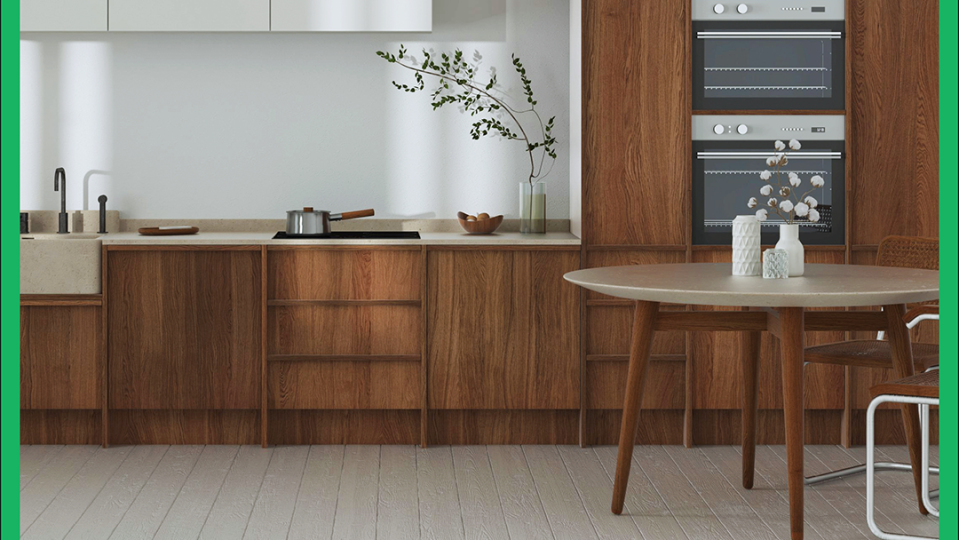 a kitchen with a table and a plant