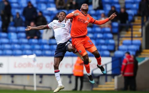 Bolton Wanderers' Lloyd Dyer competing with Millwall's Mahlon Romeo during the Sky Bet Championship match between Bolton Wanderers and Millwall at Macron Stadium on March 9, 2019 in Bolton, England. - Credit: Getty Images