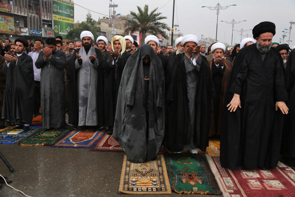 FILE - In this file photo taken Friday, Jan. 17, 2014, followers of Shiite cleric Muqtada al-Sadr crowd a street as they attend open air Friday prayers in the Shiite stronghold of Sadr City in Baghdad, Iraq. As parliamentary elections are held Wednesday, April 30, more than two years after the withdrawal of U.S. troops, Baghdad is once again a city gripped by fear and scarred by violence. (AP Photo/Karim Kadim, File)