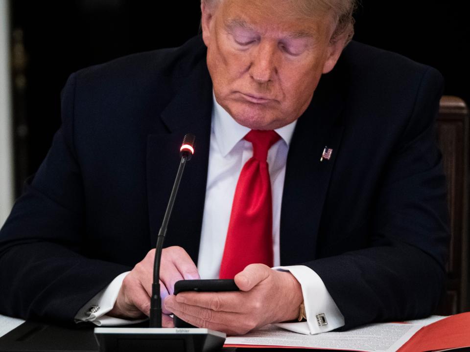 Donald Trump using cellphone