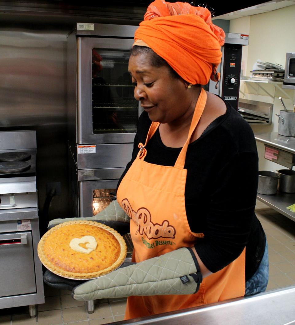 Rose McGee takes one of her famous Sweet Potato Comfort Pies out of the oven. (Photo: Courtesy of Rose McGee)