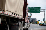 A truck heads towards the United States at the Lacolle border crossing in Lacolle, Quebec, Canada April 26, 2017. REUTERS/Christinne Muschi