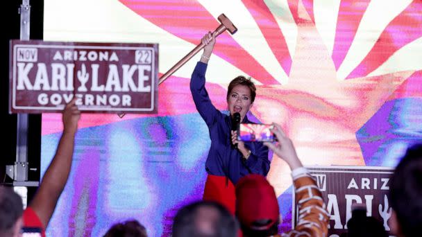 PHOTO: Republican candidate for Arizona Governor Kari Lake holds up a sledgehammer as she speaks to supporters that are waiting around as ballots continue to be counted during her primary election night gathering in Scottsdale, Ariz., Aug. 3, 2022. (Justin Sullivan/Getty Images)