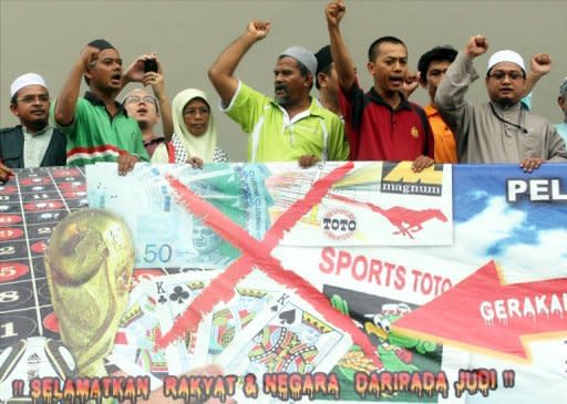 Muslims anti-gambling campaigners stage a protest at the National Mosque in Kuala Lumpur in 2010. Malaysian police said Thursday they arrested 137 people, mostly from China and Taiwan, as they busted a ring that bet on English football, staged Internet gambling, and carried out online scams