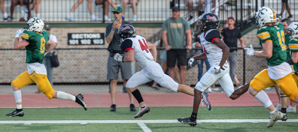 St. Xavier's Cooper Smith runs for a 95 yard touchdown from against Owensboro High. Aug. 19, 2022