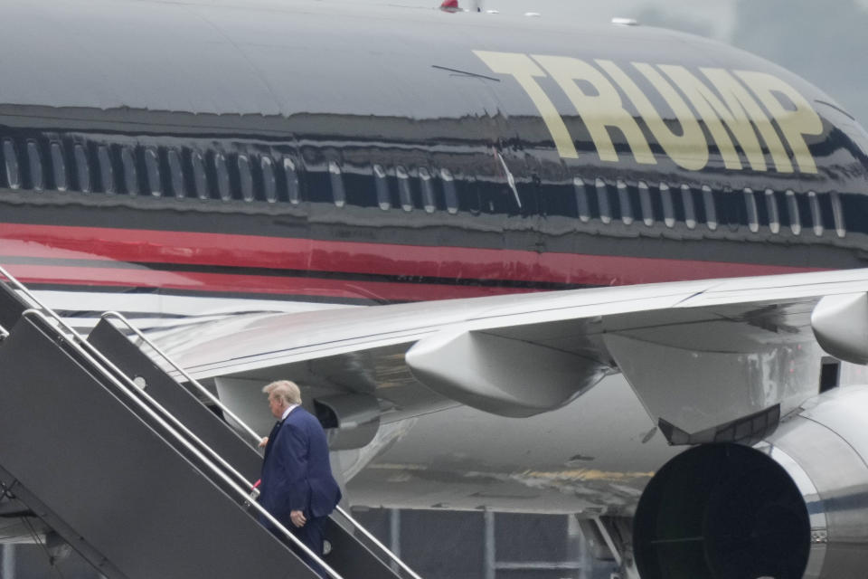 FILE - Former U.S. President Donald Trump boards his airplane at Newark Liberty International Airport, Monday, June 12, 2013 in Newark, N.J. As Trump becomes the first former president to face federal charges that could put him in jail, many Europeans are watching the case closely. But hardly a single world leader has said a word recently about the man leading the race for the Republican party nomination. (AP Photo/Bryan Woolston, File)