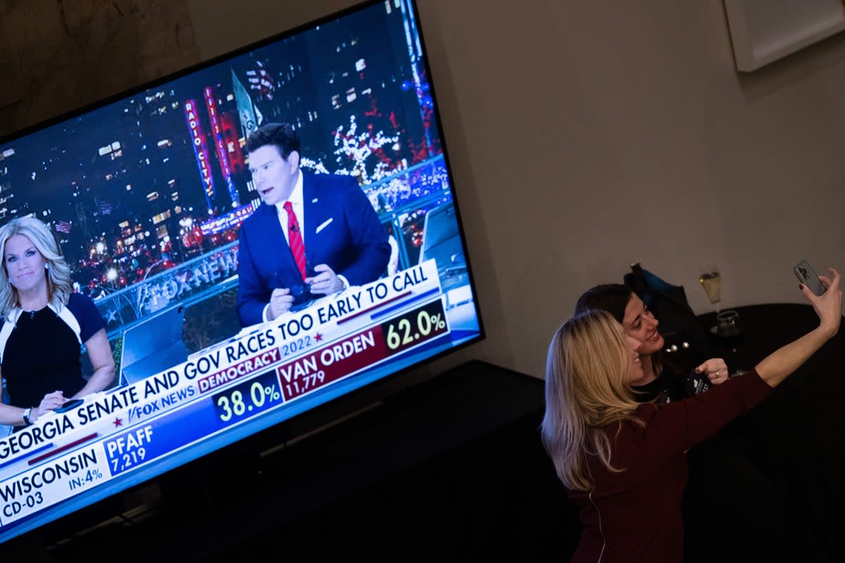 People take a selfie during an election night watch party for House Minority Leader Kevin McCarthy (AFP via Getty Images)