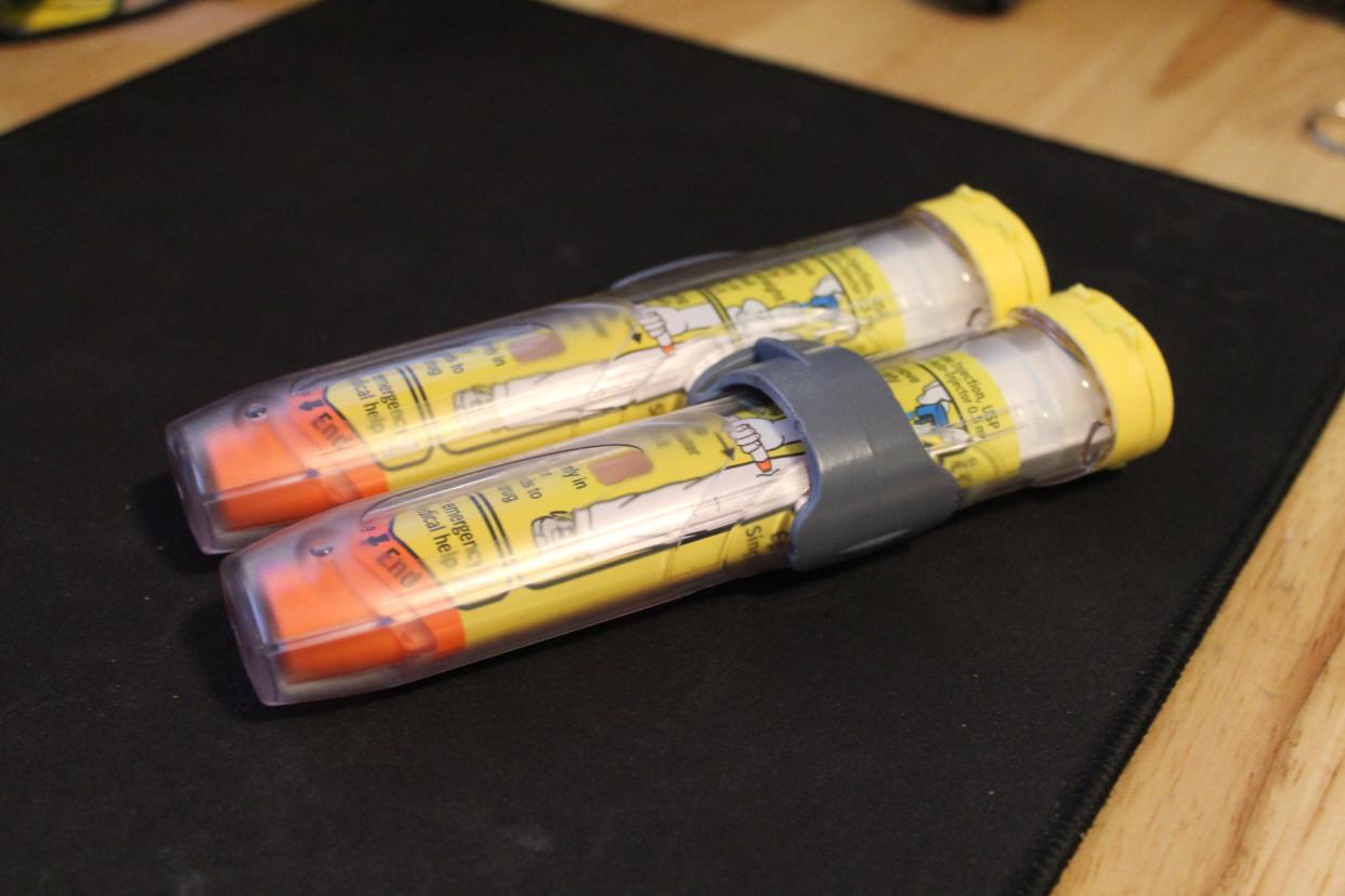 Two EpiPens sit on a desk, April 20, 2023, in Muncie, Indiana. Without insurance, EpiPens can cost about $650.