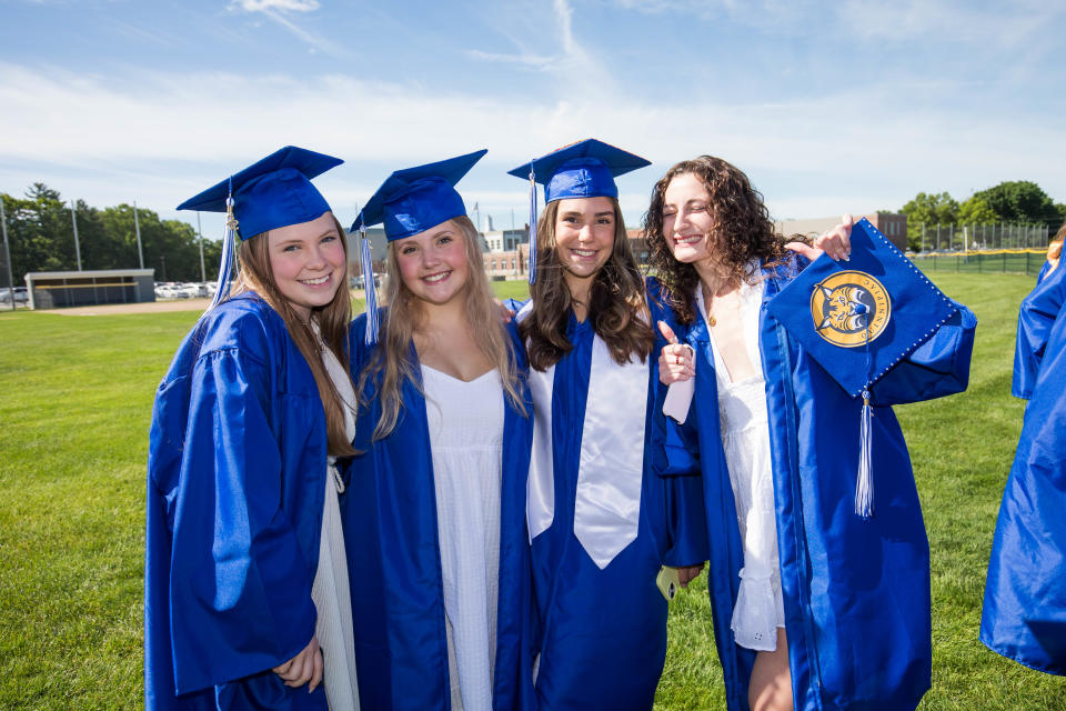 Riley Coron, left to right, Kylie Mosser, Ava Kull and Brianna Difrederico pose for a photo before their graduation on Sunday at Kennebunk High School.