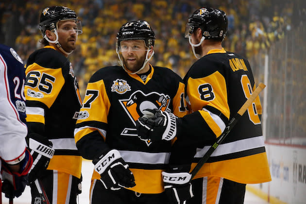 PITTSBURGH, PA – APRIL 20: Bryan Rust #17 of the Pittsburgh Penguins celebrates his second-period goal with Brian Dumoulin #8 and Ron Hainsey #65 while playing the Columbus Blue Jackets in Game Five of the Eastern Conference First Round during the 2017 NHL Stanley Cup Playoffs at PPG Paints Arena on April 20, 2017 in Pittsburgh, Pennsylvania. (Photo by Gregory Shamus/Getty Images)