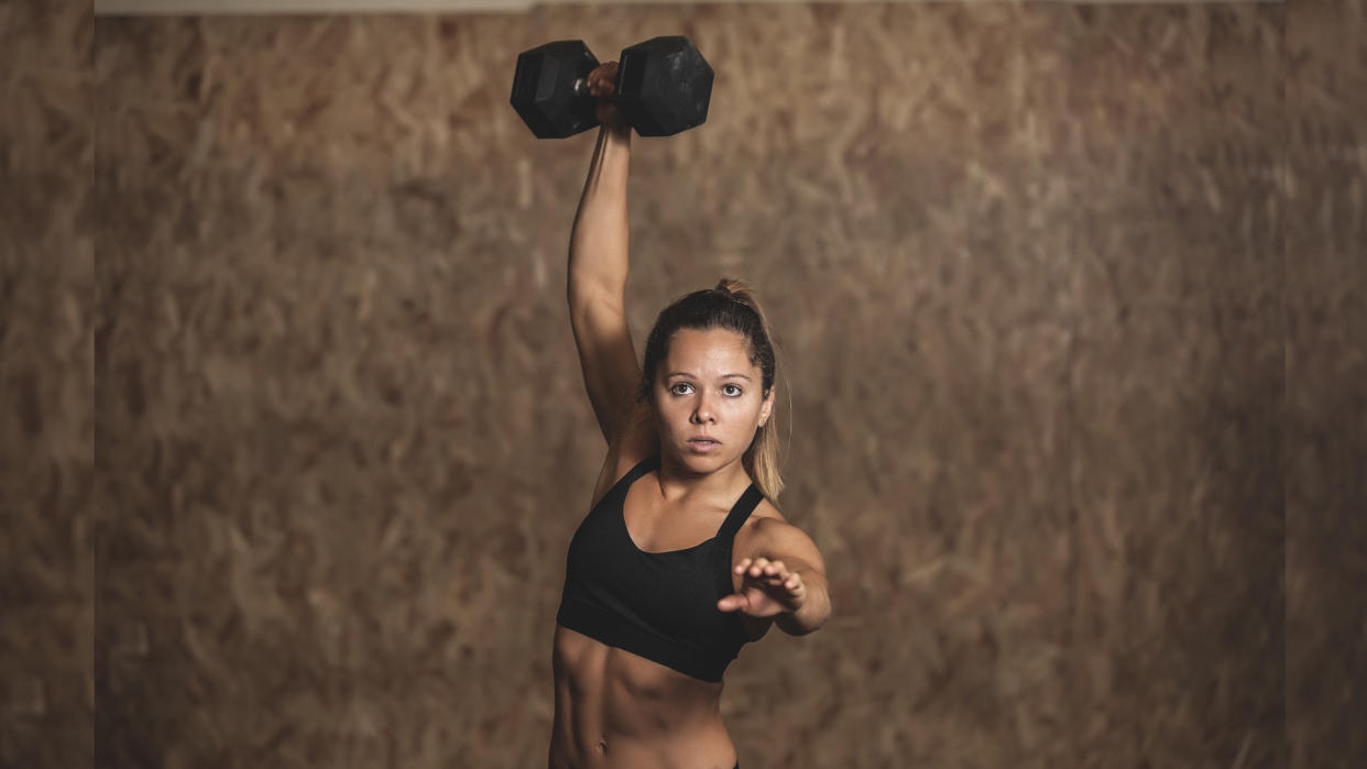  Woman doing standing ab exercise 