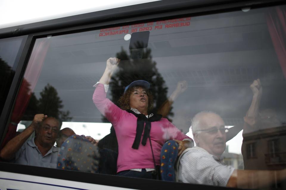 Demonstrators arrive in a bus to take part in a protest organised by the CGTP union in Lisbon