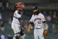 Houston Astros catcher Martin Maldonado and relief pitcher Ralph Garza Jr. (61) celebrate after the final out in the ninth inning of a baseball game against the Detroit Tigers in Detroit, Thursday, June 24, 2021. Houston won 12-3. (AP Photo/Paul Sancya)