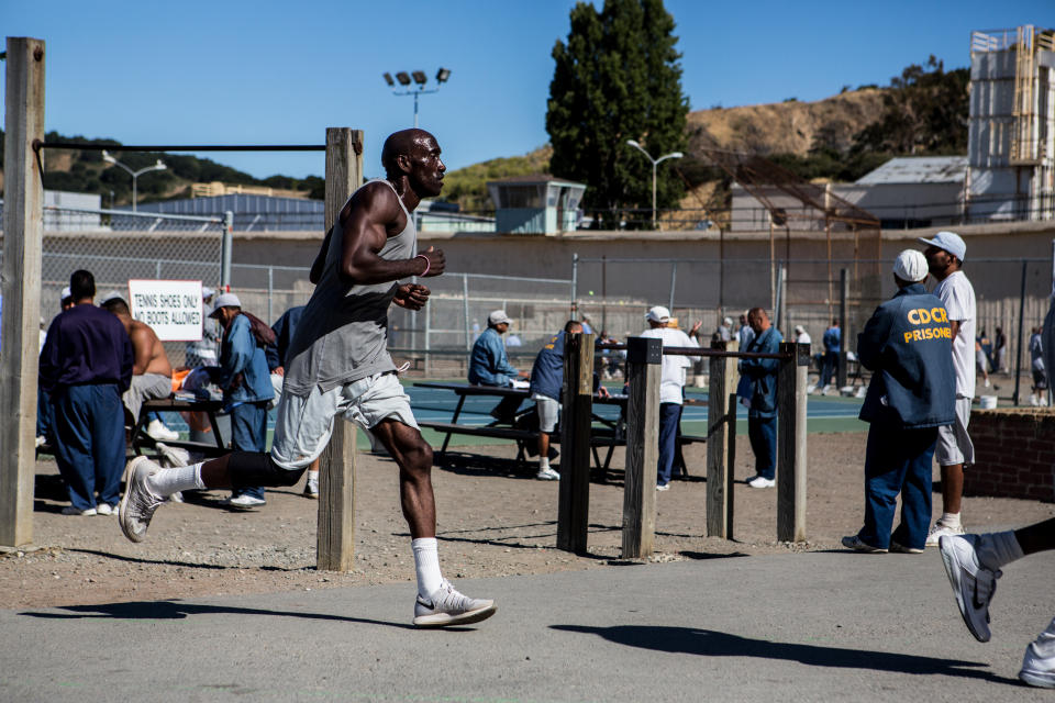 Markelle Taylor, known as "the Gazelle of San Quentin," runs on the track inside the prison yard.