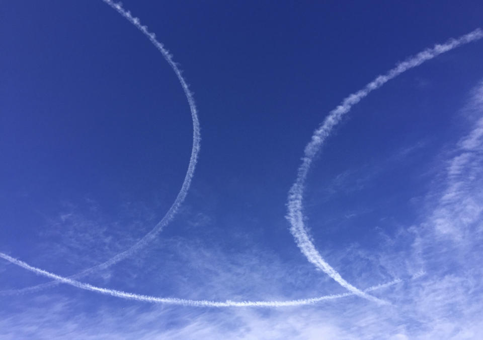 Circles of contrails made by warplanes from U.S.-led coalition flying missions in support of Iraqi troops and police in the northern Iraqi city of Mosul, Iraq, Thursday, Dec. 29, 2016. The Iraqi forces troops pushed deeper into eastern Mosul on Thursday in a multi-pronged assault after a two-week lull in the operation to retake the Islamic State-held city. (AP Photo/Hamza Hendawi)