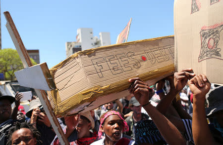 Students protest outside the parliament ahead of South African Finance Minister Pravin Gordhan's medium term budget speech in Cape Town, South Africa October 26, 2016. REUTERS/Sumaya Hisham