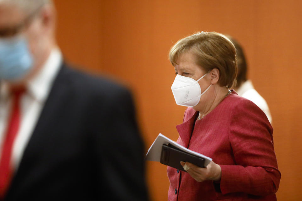 German Chancellor Angela Merkel arrives for the weekly cabinet meeting of the German government at the chancellery in Berlin, Tuesday, April 27, 2021. (AP Photo/Markus Schreiber, Pool)